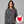 Woman wearing a gray hoodie with a pink logo on a gray background, with a red heart and devil horns icon inset.