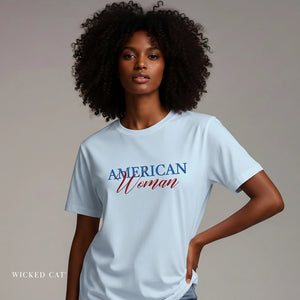 Woman wearing a light blue t-shirt with 'American Woman' text on a plain background