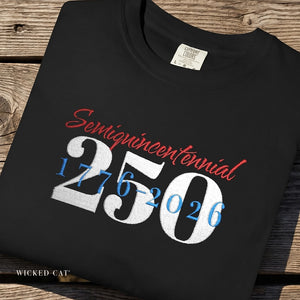 Black t-shirt with 'Semiquincentennial 2501776-2026' text on a wooden surface