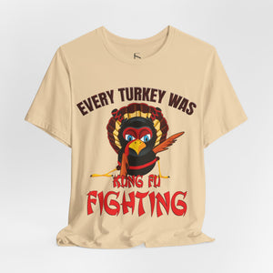 Brown t-shirt with 'Kung Fu Fighting Turkey 80s Music Funny' design on a white background