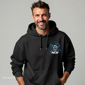 Man wearing a black hoodie with a skull design on a gray background