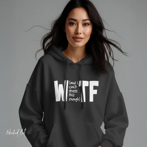 Woman wearing a black hoodie with 'WTF' text on a gray background