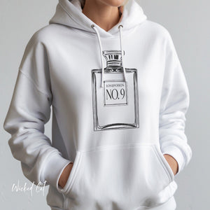 Black hoodie with 'Love Potion Perfume Witchy Halloween' design on a plain background