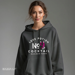Person wearing a dark gray hoodie with text design on a plain background