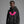 Person wearing a navy blue hoodie with 'Pink Bat Halloween' design on a plain background