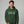 Man wearing a green hoodie with 'Spook Me' text on a gray background