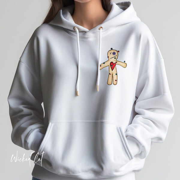 White hoodie with a cartoon voodoo doll design on a gray background