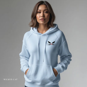 Person wearing a white hoodie with embroidered 'Wicked Cat® Embroidered' design on a plain background