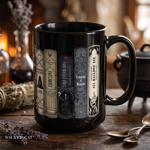 Black coffee mug with Halloween books design on a wood table.