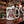 White mug with holiday-themed design on a bar counter with festive decorations