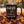 mug with 'The Most Wonderful Time of the Year Halloween' graphic on a pile of fall leaves.
