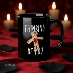 mug with 'Thinking of You Voodoo Doll Funny' graphic on a white background