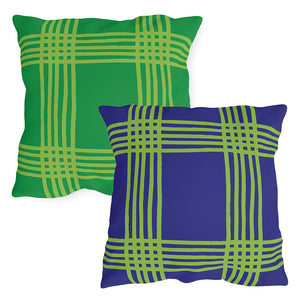 Two plaid patterned pillows, one green and one deep purple, on a white background. Reversible accent pillow.