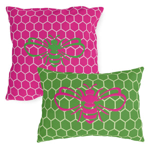 throw pillow with 'Honeycomb Bee Reversible Pink & Green' design