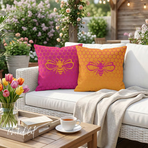 throw pillow with 'Honeycomb Bee Reversible Pink & Orange' design