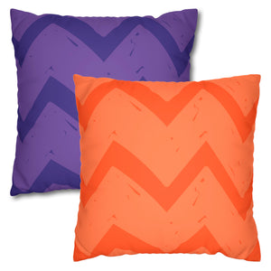 Two square faux suede pillow covers, one in vibrant orange and the other in purple, both with a chevron pattern.