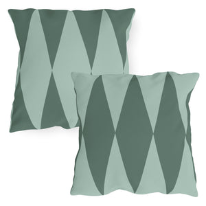 Two square outdoor throw pillows with a diamond pattern in varying shades of green.