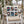 Holiday pillow in a chair with Christmas stamps on the front