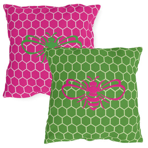 throw pillow with 'Honeycomb Bee Reversible Pink & Green' design