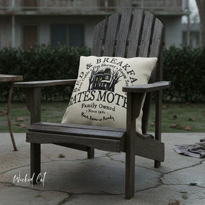 Wooden chair with a decorative pillow featuring text and graphics on a patio.