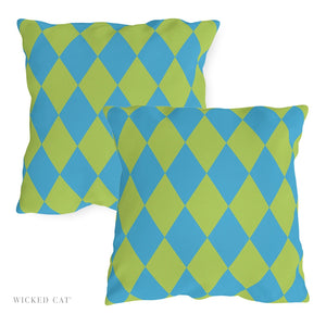 Two blue and green patterned pillows on a white background