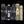 Six decorative book spines arranged upright against a black background, featuring gothic and horror-themed designs with cream, black, purple, and blue tones. Large translucent text across the center reads 'Wicked', and smaller text at the top right says 'Hand-Illustrated' and at the bottom left says 'Wicked Cat'.
