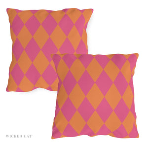 Two pink and orange checkered pillows on a white background with 'Wicked Cat' branding.