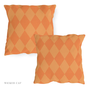 Two orange diamond-patterned pillows on a white background with 'Wicked Cat' branding.
