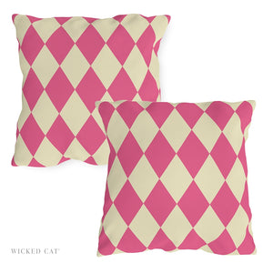Two pink and beige checkered pillows on a white background