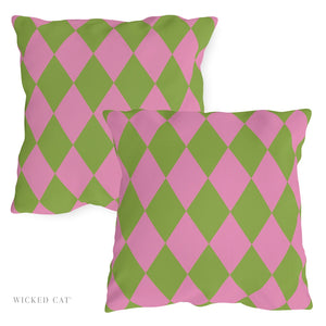 Two pink and green patterned pillows on a white background with 'Wicked Cat' branding.