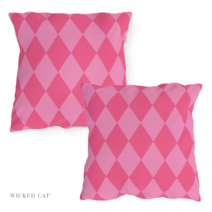 Two pink argyle patterned pillows on a white background with 'Wicked Cat' branding.