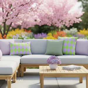 Outdoor patio with a sectional sofa, colorful cushions, and a coffee table in a garden setting.
