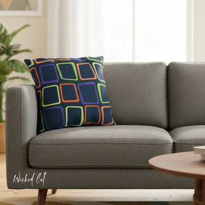 Gray sofa with a colorful geometric-patterned pillow in a living room setting.
