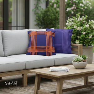 Outdoor sofa with colorful pillows and a wooden coffee table on a patio.