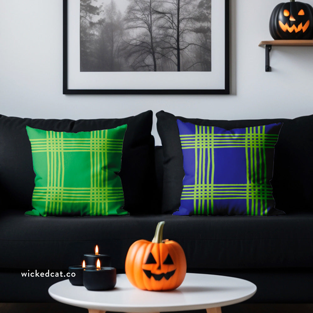 Two plaid patterned pillows, one green and one deep purple, on a white background. Reversible accent pillow.