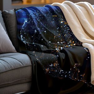 Blanket with space-themed design draped over a couch