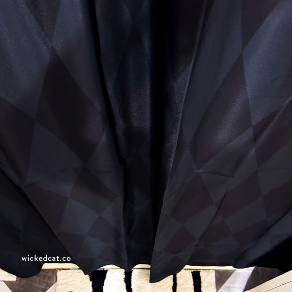 Black geometric diamond pattern on a shower curtain.