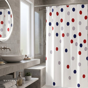 Bathroom with a polka dot shower curtain, sink, and mirror.