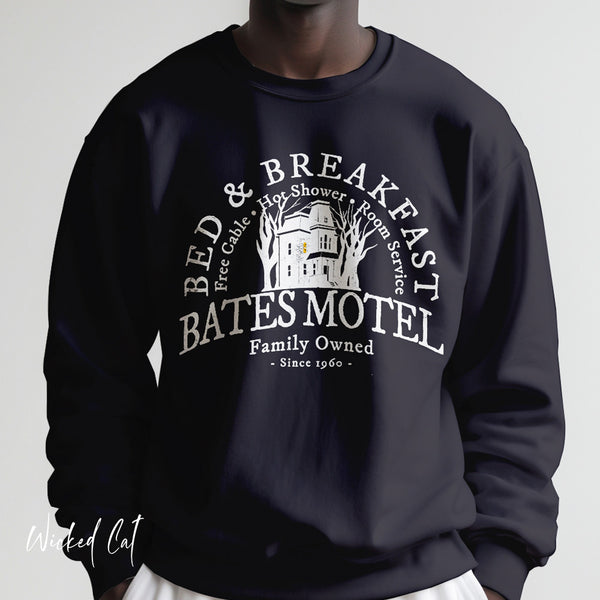 Black sweatshirt with 'Bates Motel' graphic design on a plain background