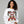 Woman wearing a white sweatshirt with a Christmas-themed design featuring Santa Claus and 'Moonshine Distillery'.