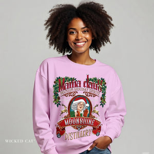 Person wearing a pink sweatshirt with a 'Mama Claus' design on a gray background
