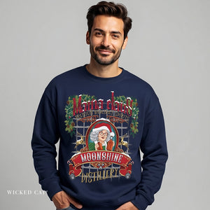 Man wearing a navy blue sweatshirt with a 'Moonshine Distillery' graphic design on a gray background