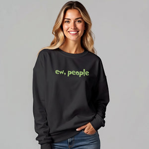 Blond woman wearing a black sweatshirt with 'ew, people' embroidered on the front.
