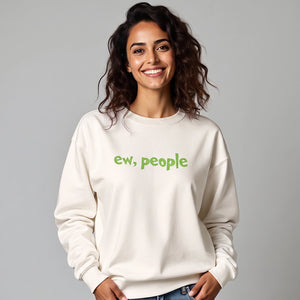 Woman wearing a white sweatshirt with 'ew, people' embroidered on the front.