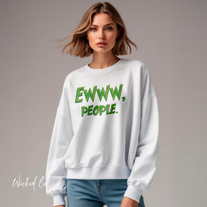Woman wearing a white sweatshirt with green text that reads Ewww, People. on a gray background