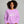 Woman wearing a purple sweatshirt with 'Love Potion No. 9' text on a gray background
