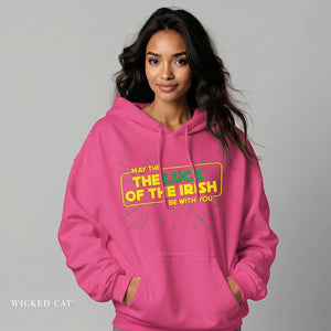 Woman wearing a pink hoodie with a colorful text design on a gray background