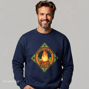Man wearing a navy blue sweatshirt with a campfire graphic and text on a gray background