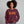 Woman wearing a maroon sweatshirt that says Start Jumping