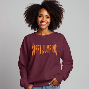 Woman wearing a maroon sweatshirt that says Start Jumping